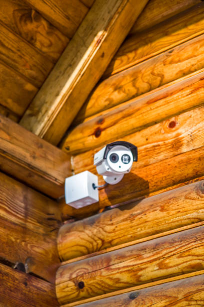 istock Security camera on the wooden house 1294615185