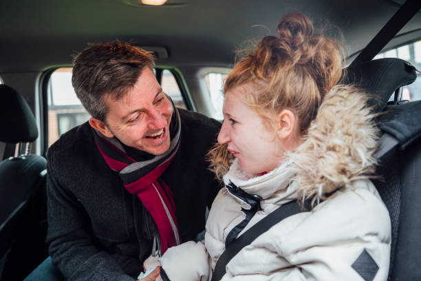 Father and Daughter Preparing for a Car Journey
