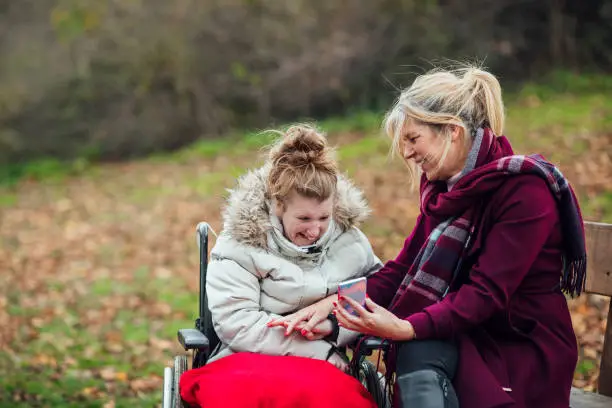 Photo of Mother and Daughter Using Smart Phone