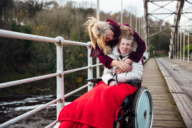 istock Mother and Daughter Cuddle on an Autumn Walk 1294616093
