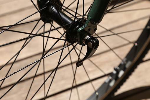 A hybrid bicycle wheel axle and hub.