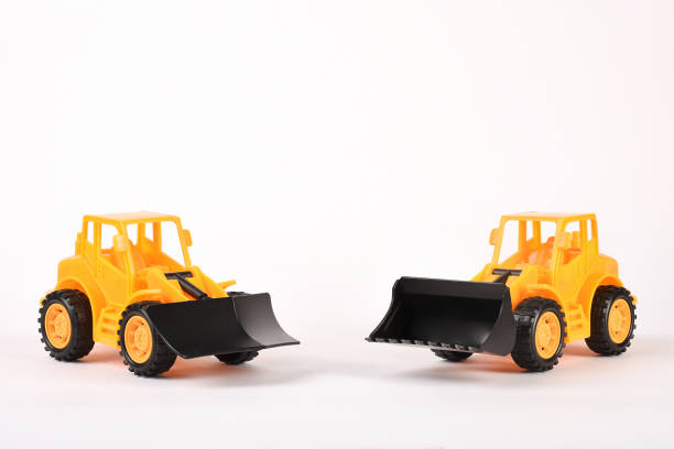 istock Toy bulldozer construction vehicles on the white background 1294618596