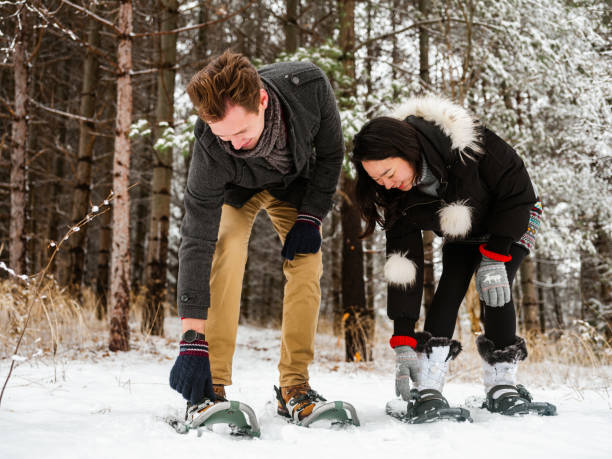 istock Mixed race couple snowshoeing in winter 1294619396