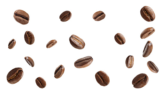 falling roasted aromatic coffee beans on white background