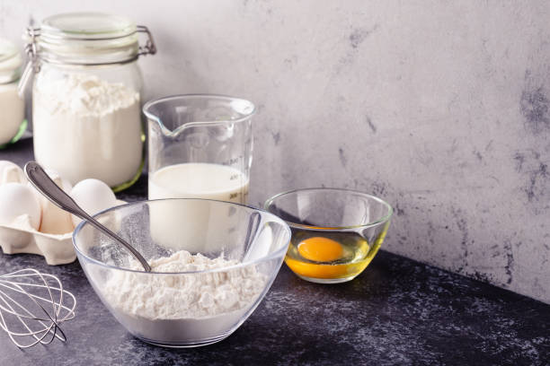 istock Baking background. Cooking ingredients for dough, eggs, flour, sugar, milk 1294624224