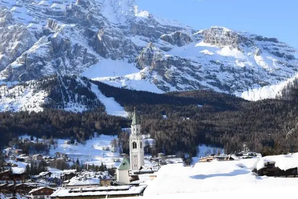 CORTINA D'AMPEZZO BELLUNO ITALIA DICEMBRE 2020 Beautiful image of the curtain bell tower with the Tofane behind