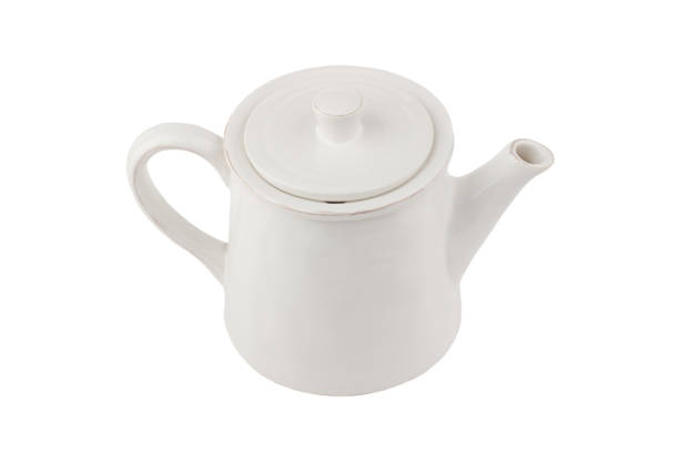 istock White ceramic teapot for coffee or tea, white background 1294632823