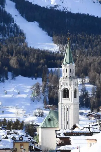 CORTINA D'AMPEZZO BELLUNO DOLOMITI ITALIA DICEMBRE 2020 Beautiful image of the curtain bell tower with the Tofane behind