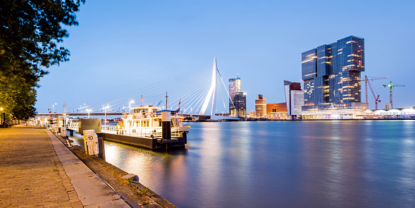Rotterdam, Netherlands - June 10, 2016: Skyline of Rotterdam with Erasmus Bridge in the dusk. Netherlands.