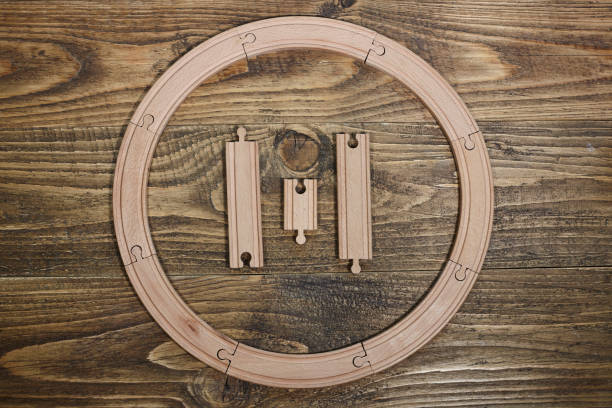 istock wooden railroad toy on table. 1294634119