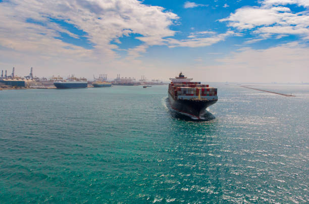 istock Container ship leaving the port,aerial view. 1294634554