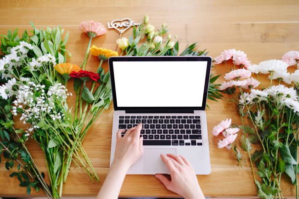 istock Fresh flowers and laptop mockup, Valentine concept 1294636747