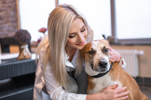 istock Beautiful woman hugging a dog 1294640692