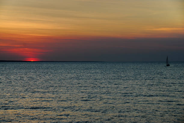 Colorful sunset through smoky skies in Fannie Bay, Darwin, Norther Territory, Australia