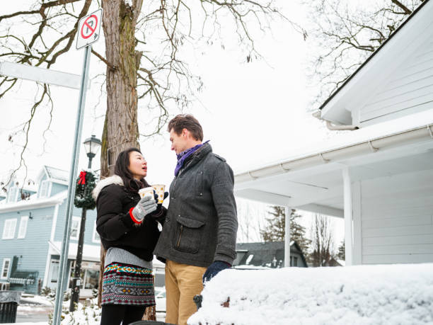 istock Mixed race couple drinking coffee outdoors 1294641116