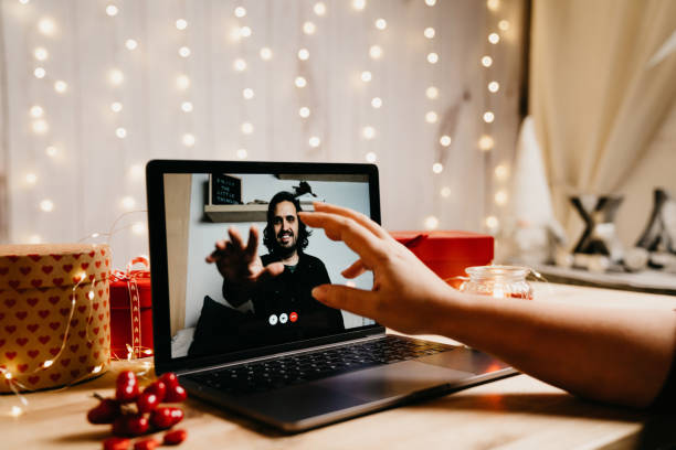 istock Young couple having a videoconference on Valentine's day 1294643104