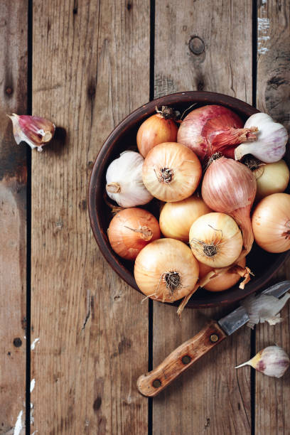 istock Yellow, red onions and garlic. 1294644868