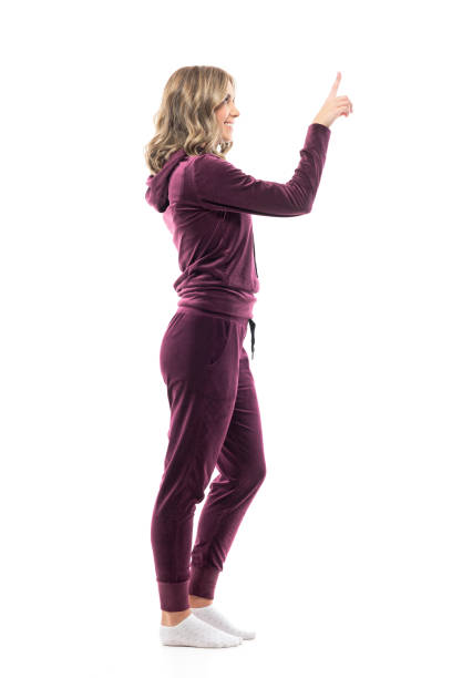 istock Side view of young pretty happy woman pointing finger showing interactive touch screen. 1294645499