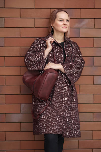 istock Woman posing with a backpack in the city 1294646294