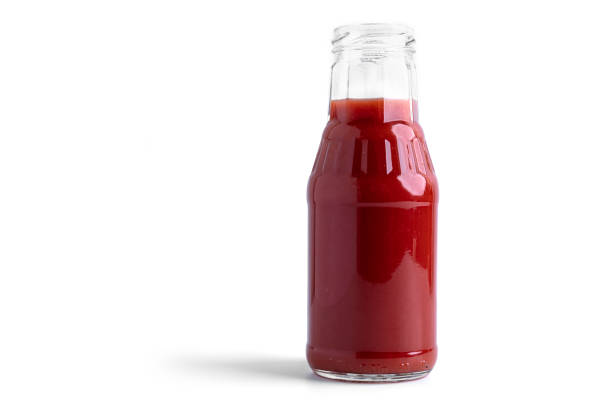 istock Tomato juice in glass on a white background. View from the top 1294646789