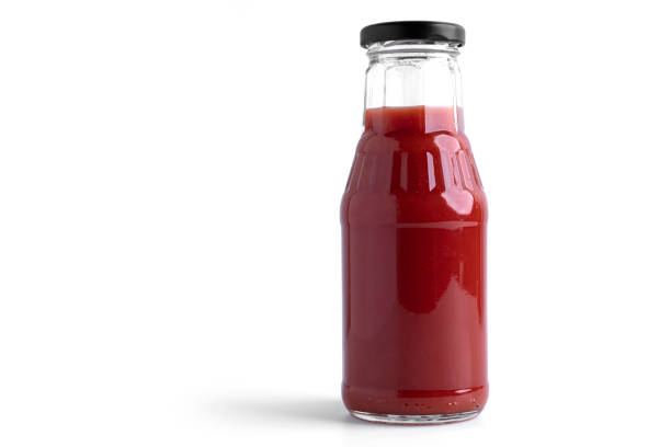 istock Tomato juice in glass on a white background. View from the top 1294648302