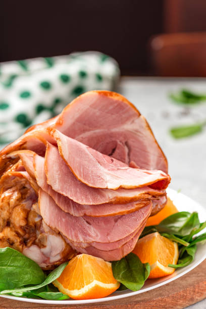 istock Sliced ham in a plate close-up 1294649503