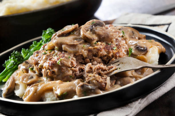 istock Salisbury Steak in a Rich Mushroom and Onion Gravy with Mashed Potatoes 1294649511