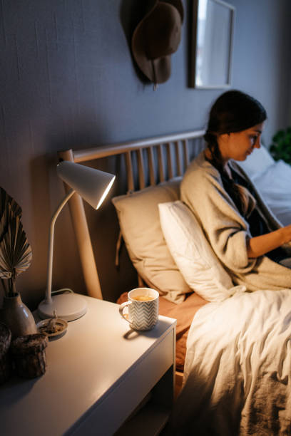 istock Hot cup of tea on a night stand 1294656117