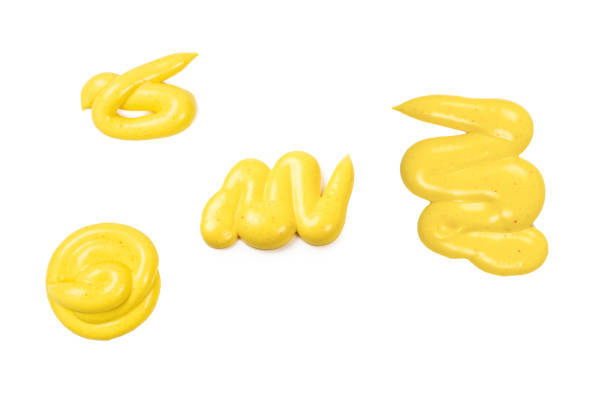 istock Yellow sauce splashes isolated on white background. 1294657076