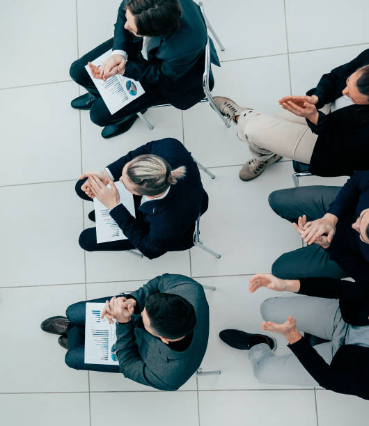 istock project Manager asking questions at a meeting with the working group 1294657279