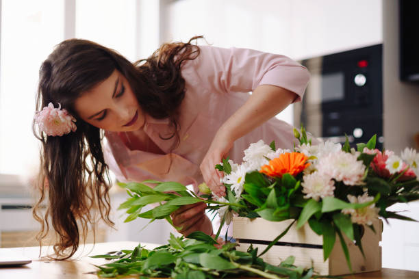 istock Beautiful florist arranging a flower composition 1294658049