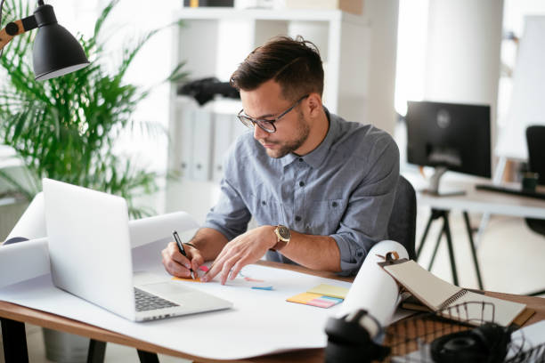 istock Happy businessman working in the office. 1294659047