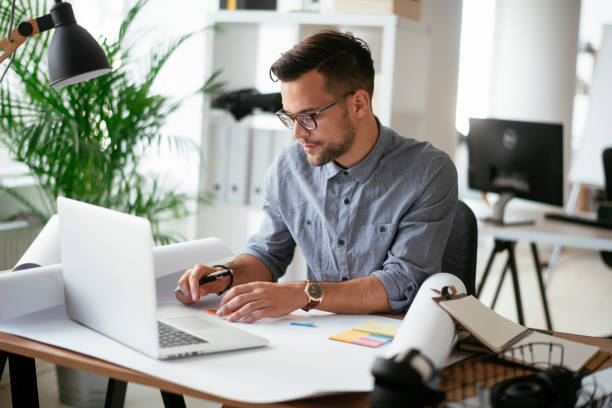 istock Happy businessman working in the office. 1294659056