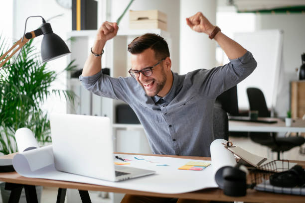istock Happy businessman working in the office. 1294659815