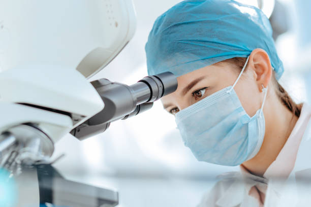 istock female scientist using a microscope in a medical laboratory 1294662442