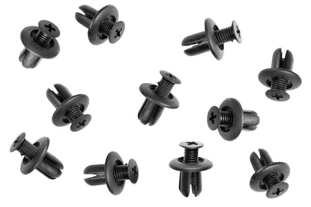 istock Macro shot plastic black clips for the car. Panel plastic rivets Isolated on a white background. Automotive clips . Auto plastic fasteners. Clip or auto plastic fastener isolated 1294662973