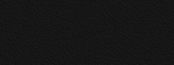 istock Abstract black stone wall, background - in the form of a rough embossed stone surface 1294663054