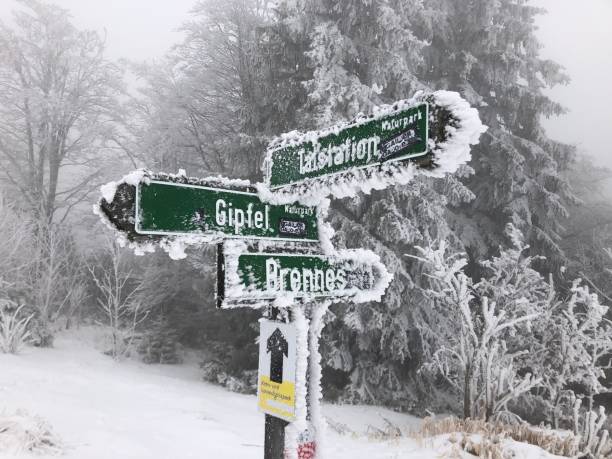 istock A snowy sign post at a hiking trail 1294666677