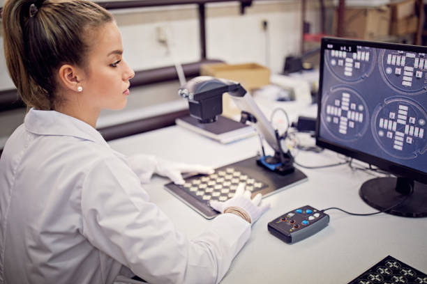 Woman is working in circuit board factory