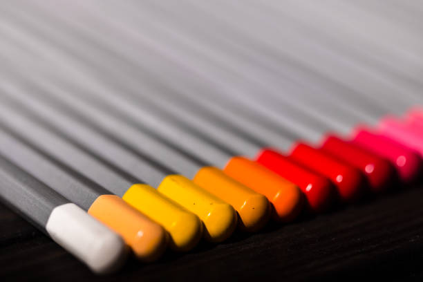 Group of colored pencils in different compositions