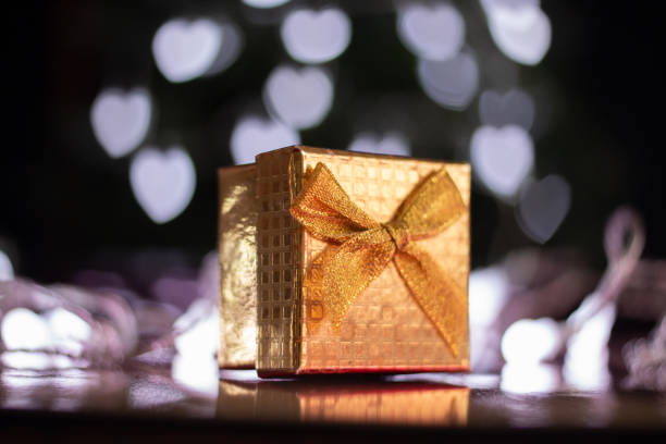 istock Valentine's Day gift with Heart shaped neon lights background 1294670445