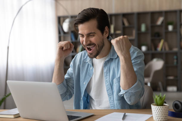 istock Excited man feel euphoric with good news online 1294670627