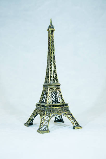 istock Small bronze copy of Eiffel tower figurine isolated on white background. The main attraction of Paris. 1294671010