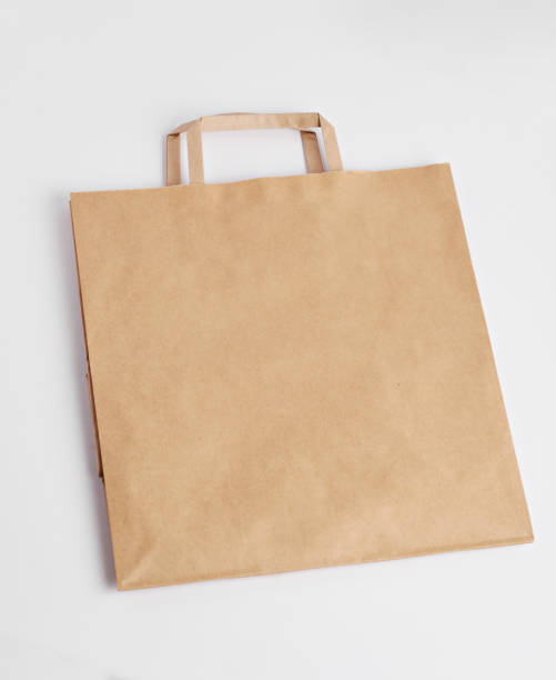 istock Recyclable Brown Paper Bag Lying on a White Background 1294671488