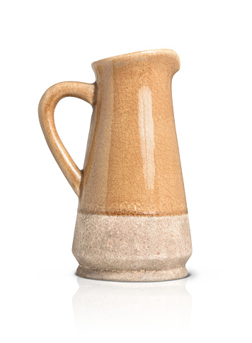 Empty brown ceramic jug for flowers with handle on white isolated background.