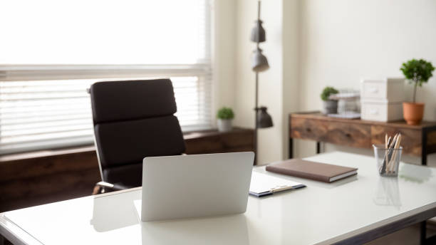 istock Close up view of empty office desk with computer 1294678740