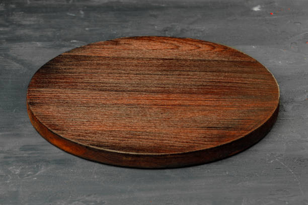 Circle wooden board on stone table background
