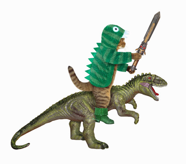 istock Cat in dragon clothing rides rex 1294682364