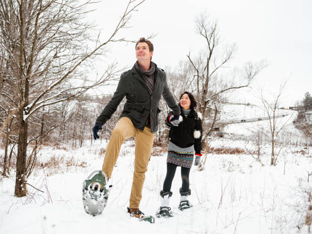 istock Mixed race couple snowshoeing in winter 1294682426