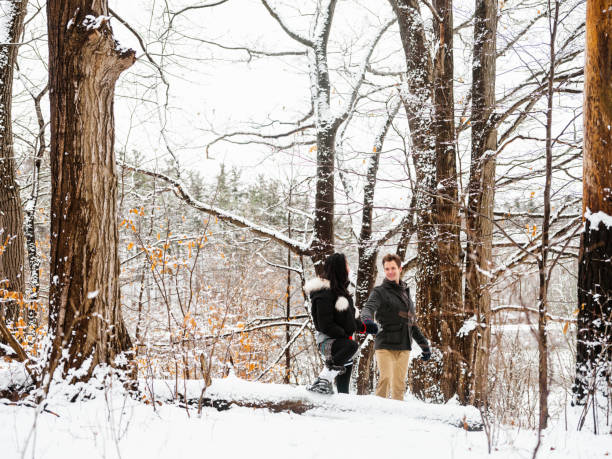 istock Mixed race couple snowshoeing in winter 1294682428